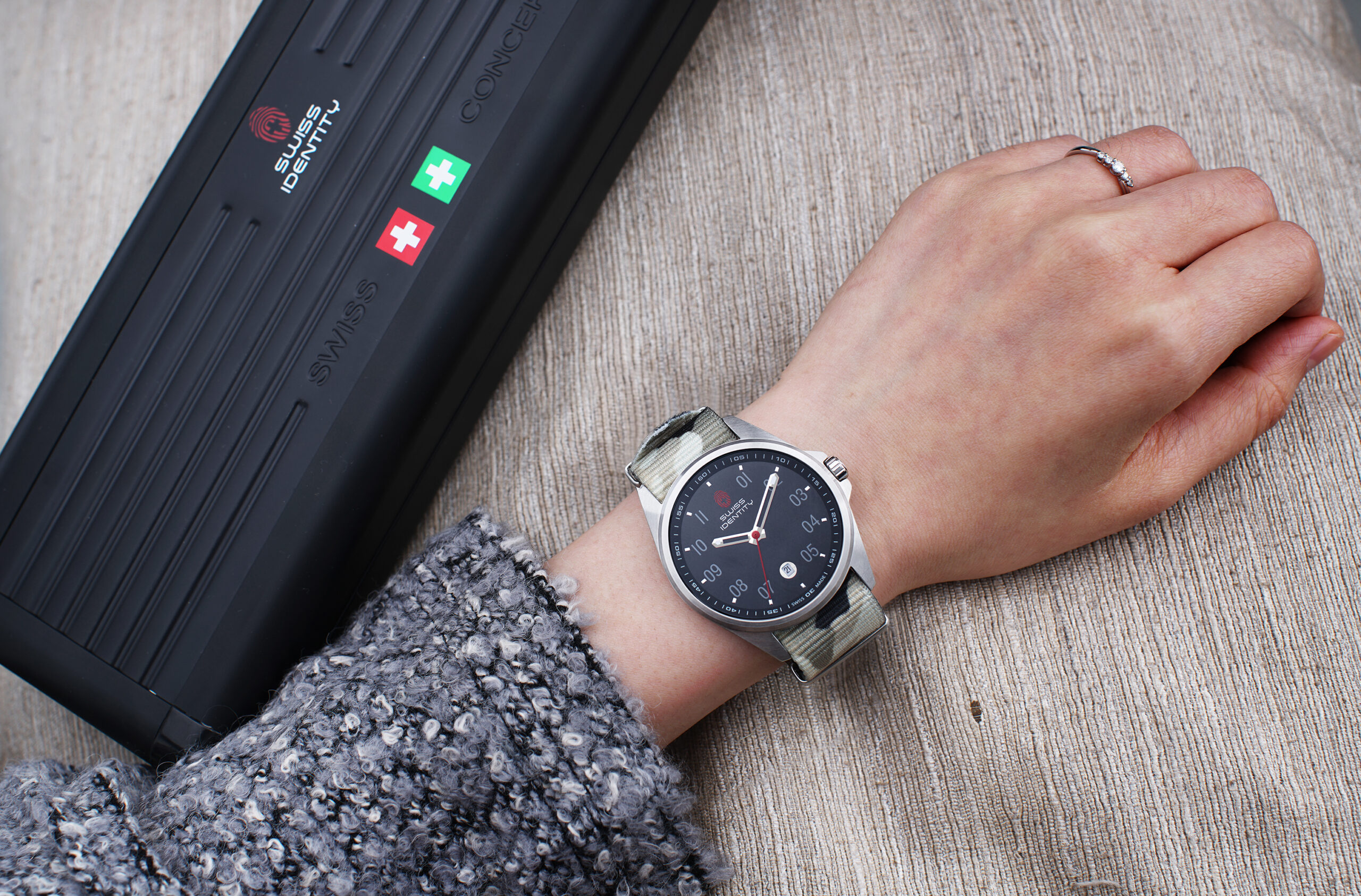 SIT watch worn next to the black aluminium kit